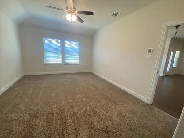 an empty room with a empty space and a window