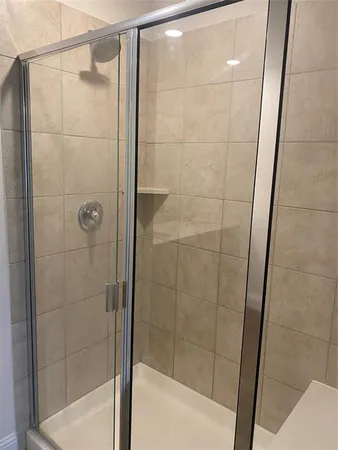 a bathroom with a shower and toilet