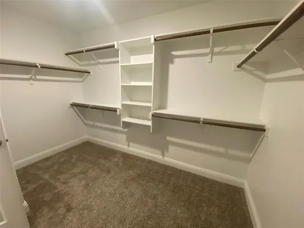 a view of an empty walk in closet