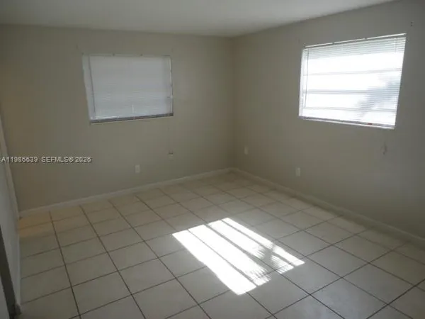 a view of a room that has a window in it