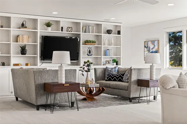 a living room with furniture and a window