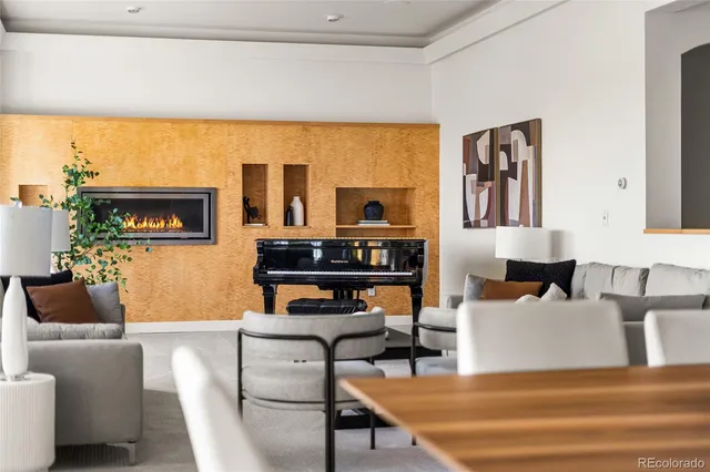 a living room with furniture and potted plant