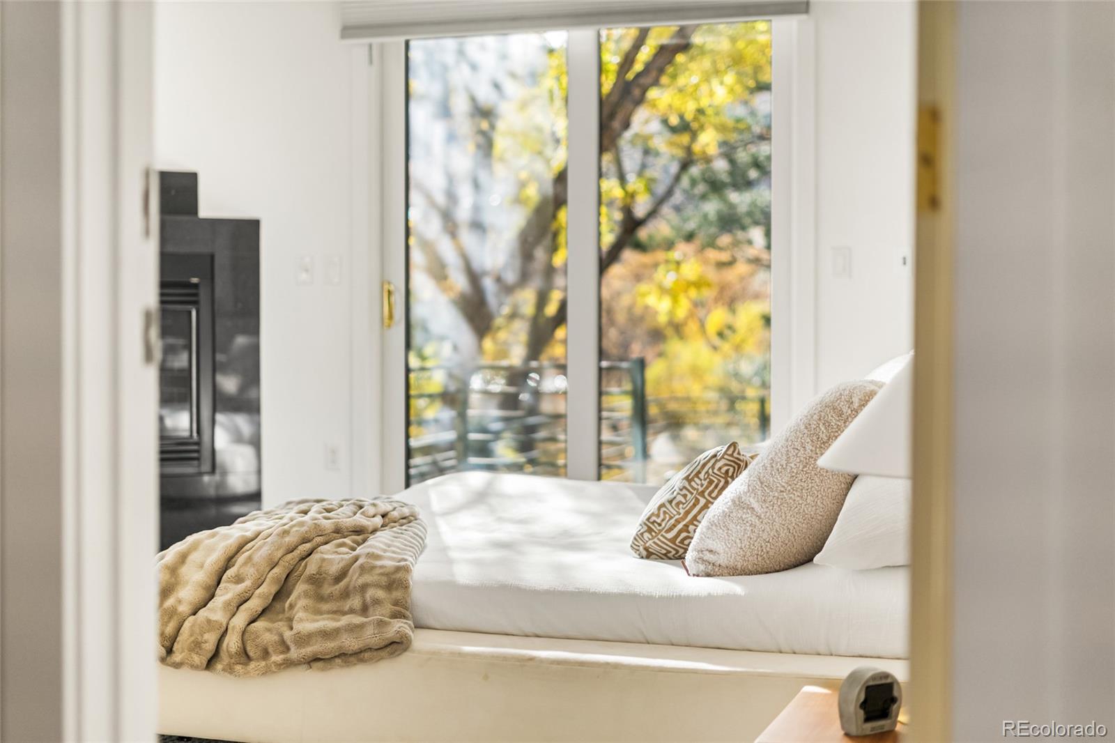 700 Utica Avenue Boulder, CO 80304 - Photo 21 of 50 a bedroom with a bed and a large window