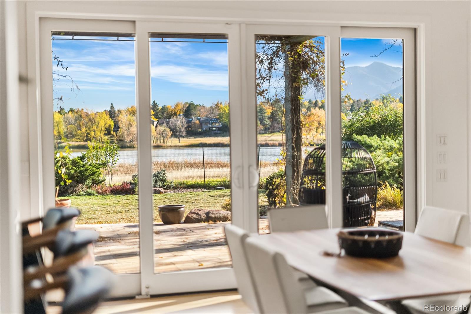 700 Utica Avenue Boulder, CO 80304 - Photo 29 of 50 a view of a dining room with a table chairs and windows