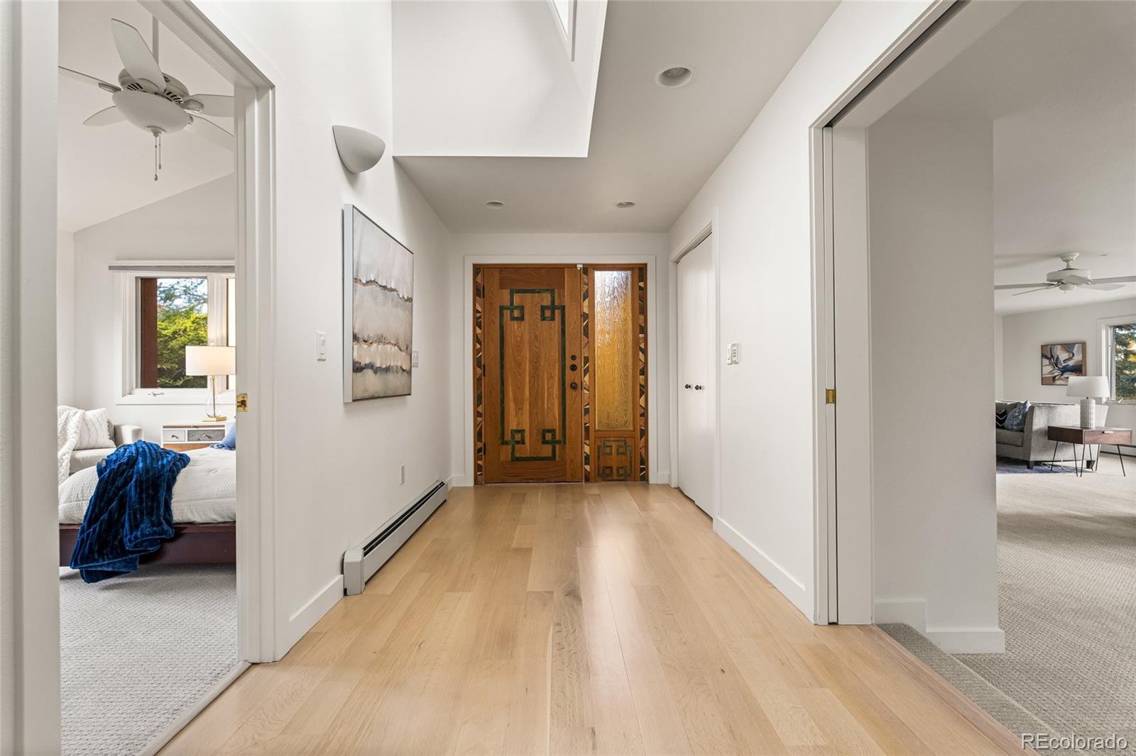 700 Utica Avenue Boulder, CO 80304 - Photo 31 of 50 a view of a hallway with wooden floor and furniture