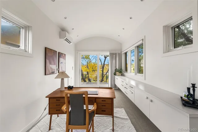 a view of roof deck with wooden fence and floor