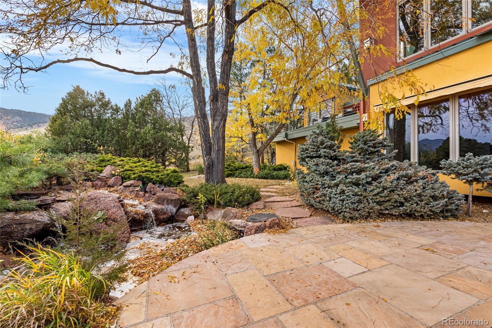 700 Utica Avenue Boulder, CO 80304 - Photo 49 of 50 a view of a backyard with plants and large trees