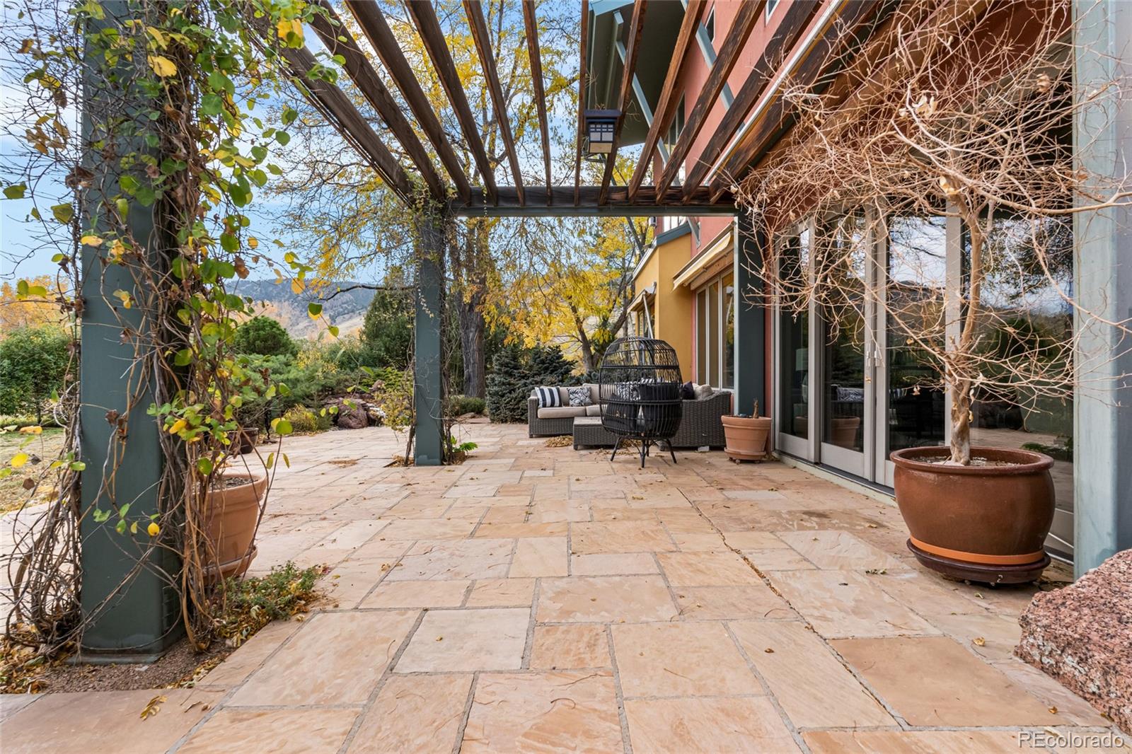700 Utica Avenue Boulder, CO 80304 - Photo 50 of 50 a view of a patio with table and chairs and potted plants