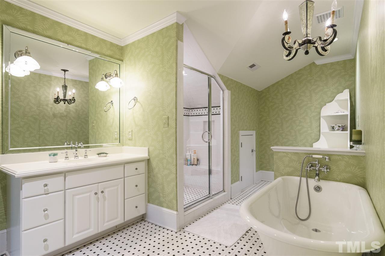 3202 Birnamwood Road Raleigh, NC 27607 - Photo 17 of 25 a bathroom with a double vanity sink mirror and bathtub