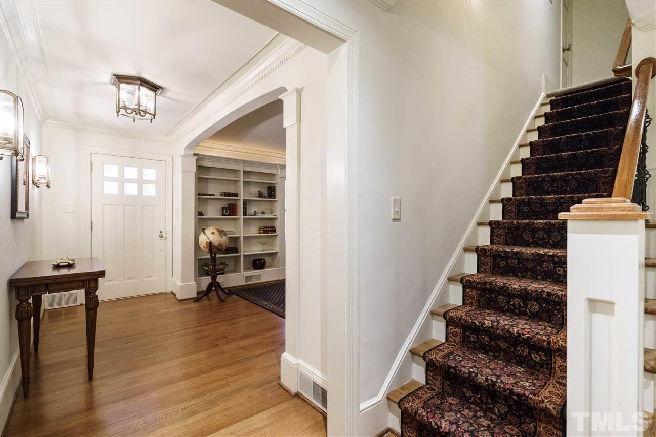 3202 Birnamwood Road Raleigh, NC 27607 - Photo 3 of 25 a view of an entryway with wooden floor and stairs