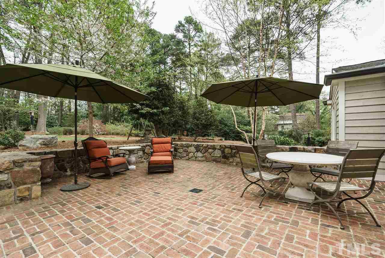 3202 Birnamwood Road Raleigh, NC 27607 - Photo 24 of 25 a view of backyard with outdoor seating and trees