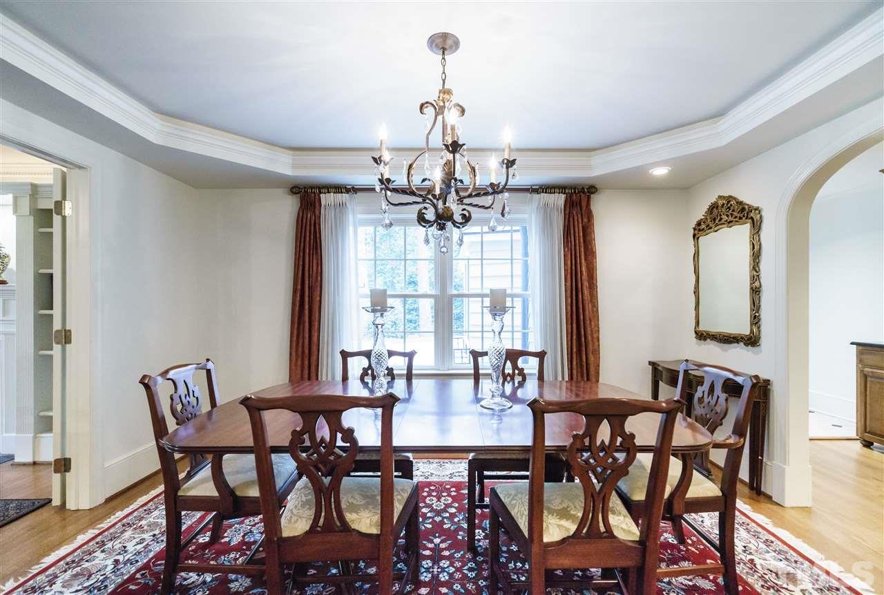 3202 Birnamwood Road Raleigh, NC 27607 - Photo 5 of 25 a view of a dining room with furniture and chandelier