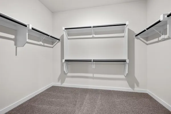 a view of an empty walk in closet