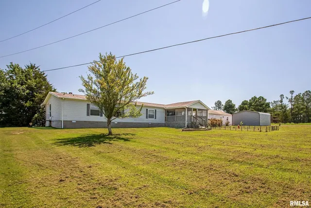 a house with swimming pool in front of it