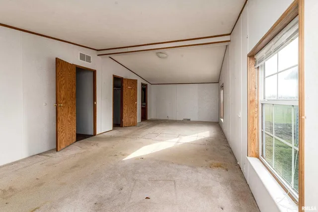 a view of a lake with a yard