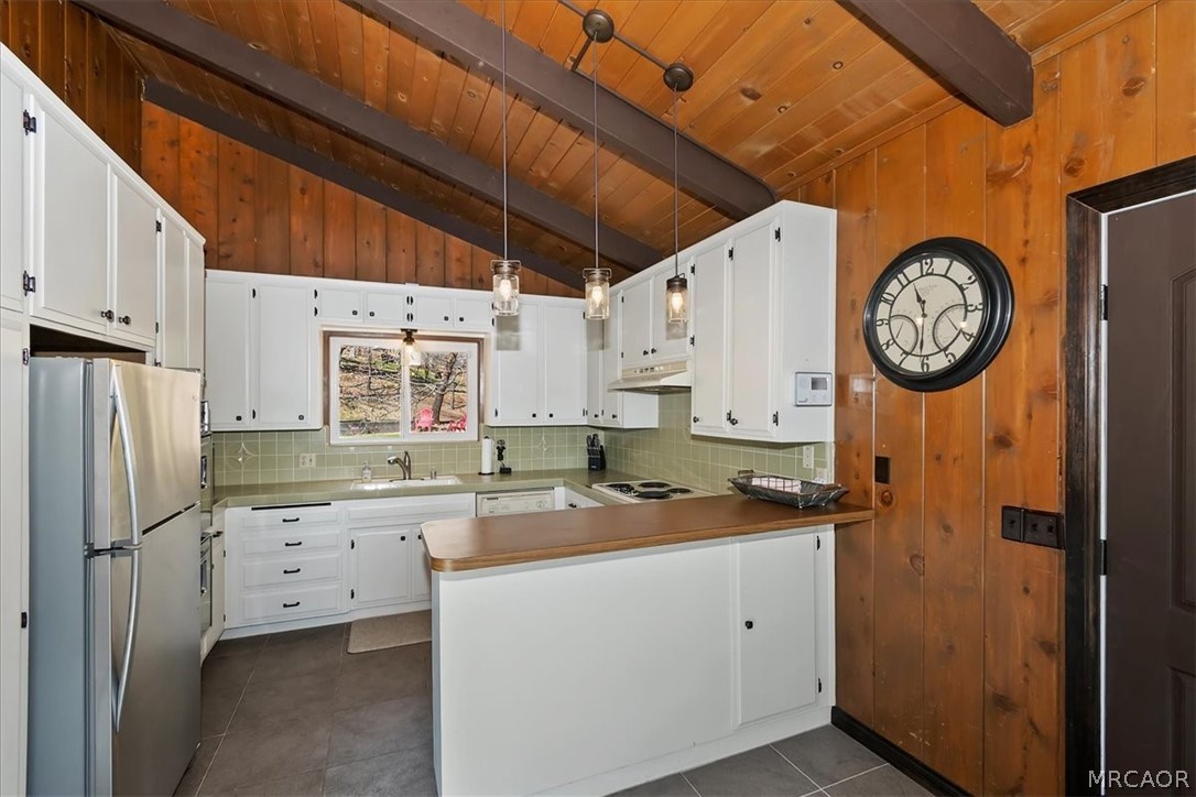 27994 West Shore Road Lake Arrowhead, CA 92352 - Photo 12 of 30 a kitchen with a refrigerator a sink and wooden floor