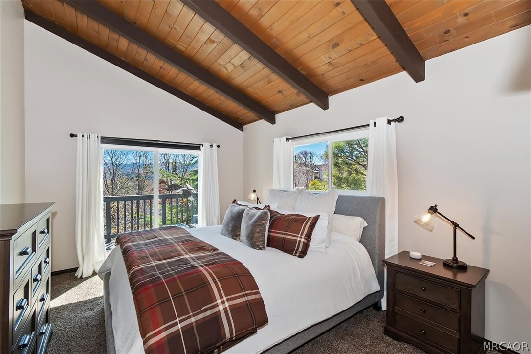 27994 West Shore Road Lake Arrowhead, CA 92352 - Photo 15 of 30 a bed sitting in a bedroom next to a window