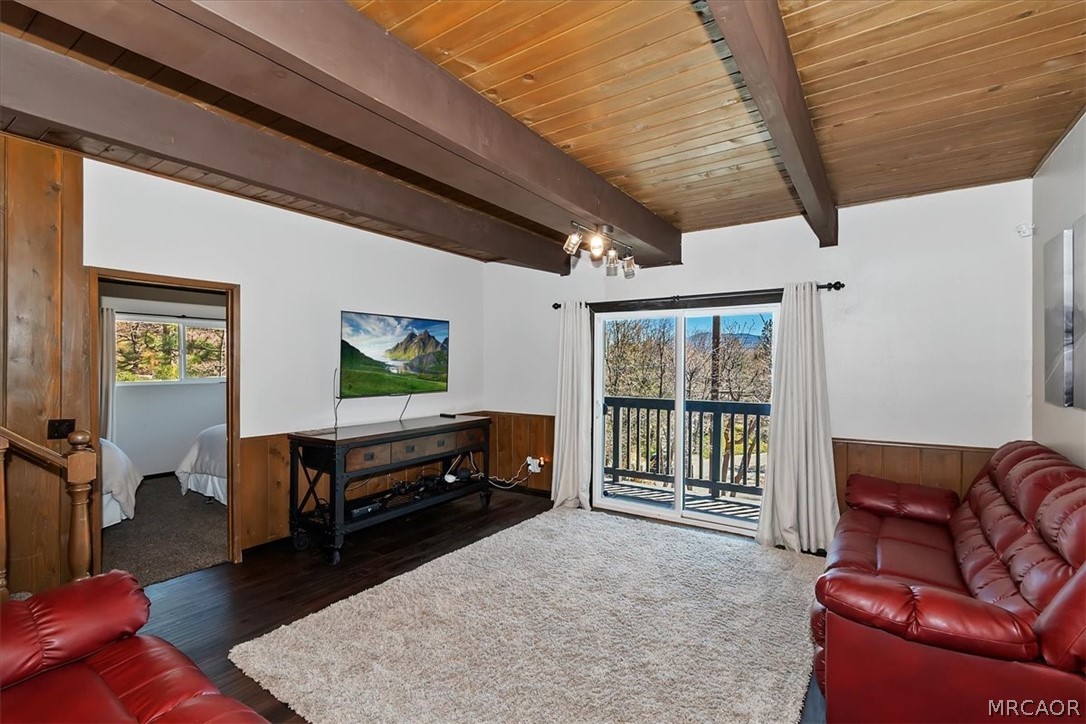 27994 West Shore Road Lake Arrowhead, CA 92352 - Photo 18 of 30 a living room with furniture a window and a flat screen tv