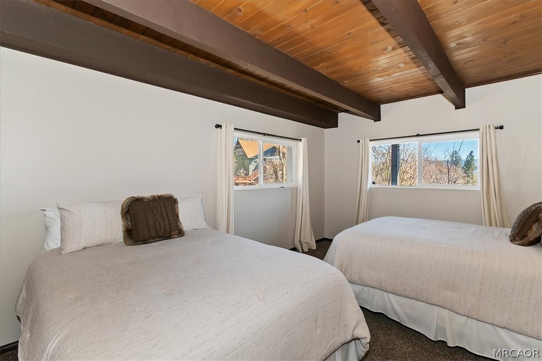 27994 West Shore Road Lake Arrowhead, CA 92352 - Photo 20 of 30 a bedroom with a large bed and a painting on the wall