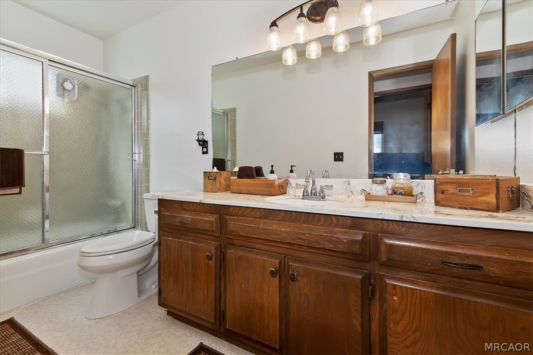 27994 West Shore Road Lake Arrowhead, CA 92352 - Photo 22 of 30 a bathroom with a sink a toilet and shower