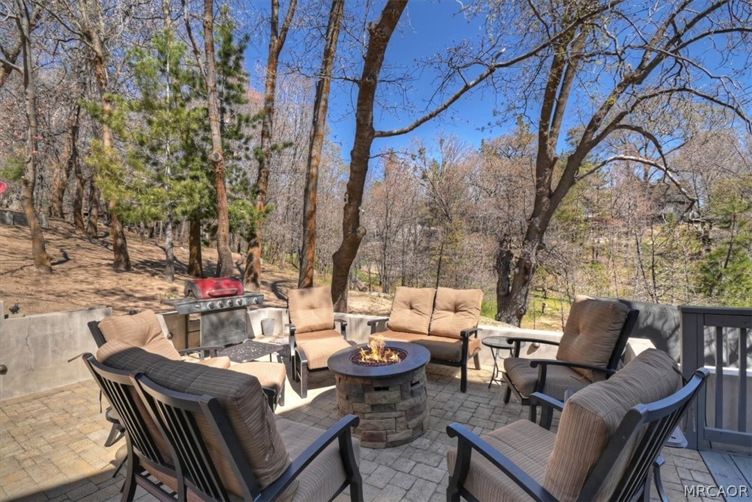 27994 West Shore Road Lake Arrowhead, CA 92352 - Photo 24 of 30 a view of a backyard with sitting area