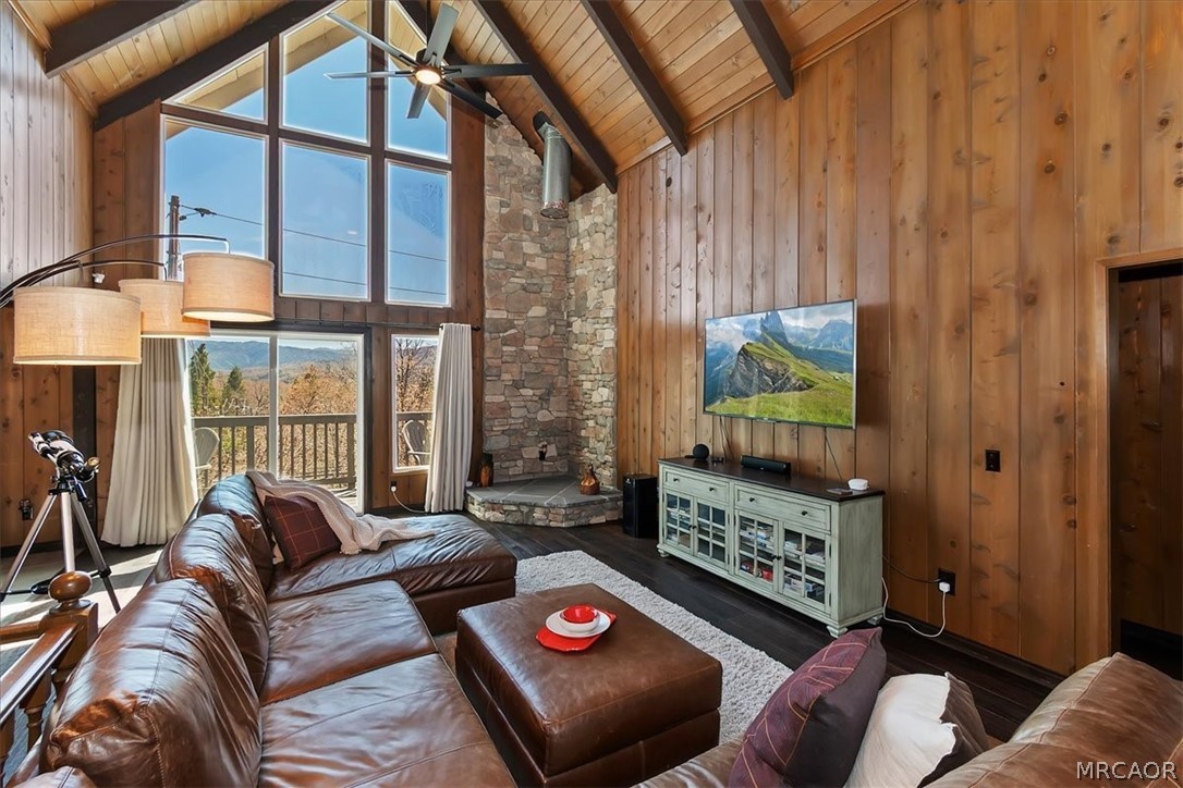 27994 West Shore Road Lake Arrowhead, CA 92352 - Photo 6 of 30 a living room with furniture and a flat screen tv