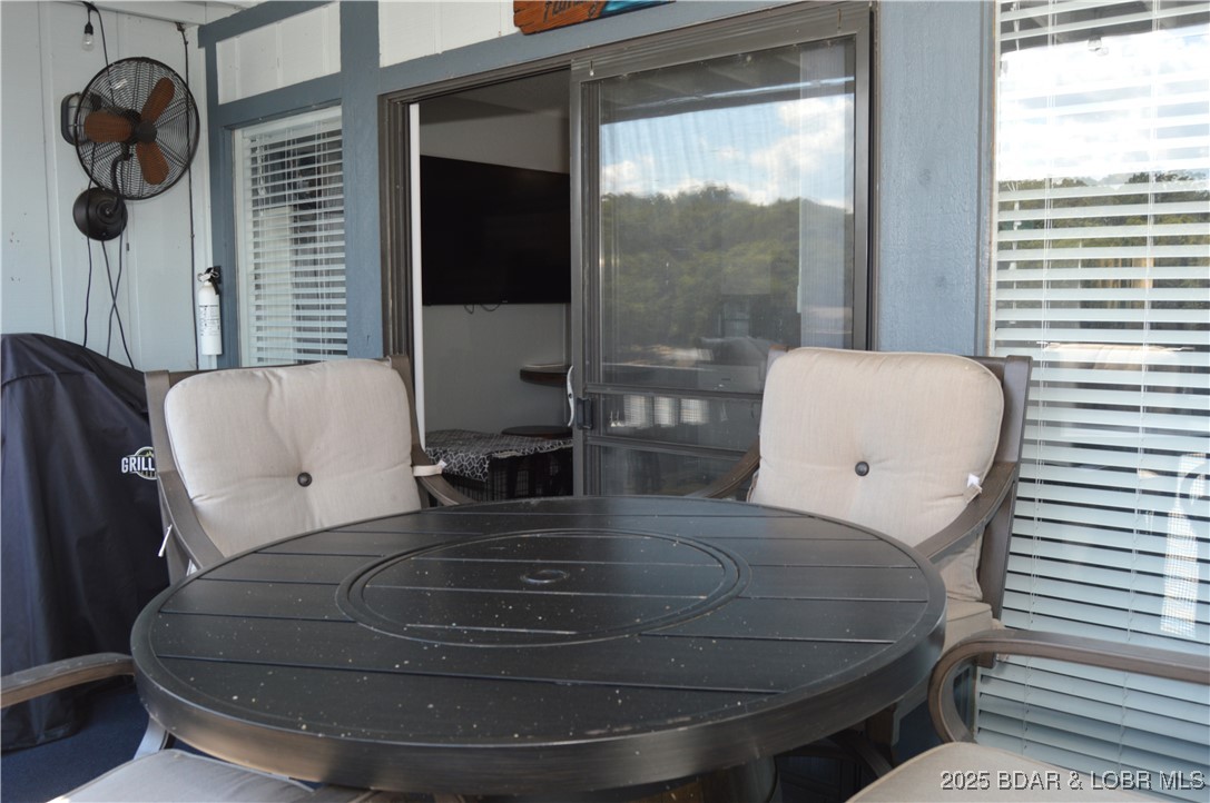 1442 Nichols Road, Unit B304 Osage Beach, MO 65065 - Photo 17 of 31 Deck view to living room