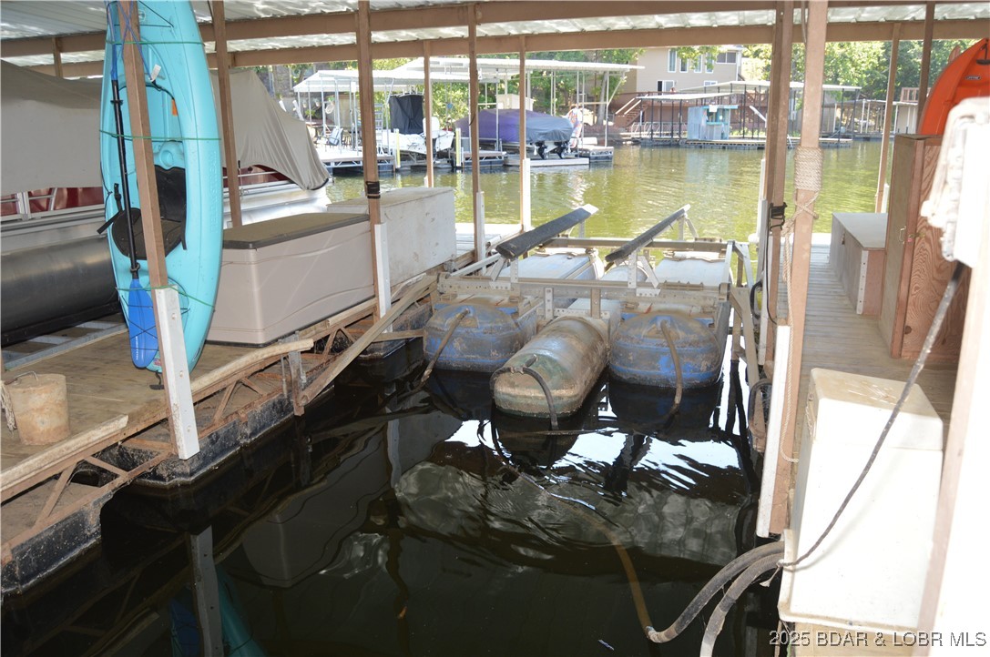 1442 Nichols Road, Unit B304 Osage Beach, MO 65065 - Photo 24 of 31 Boat slip with hoist