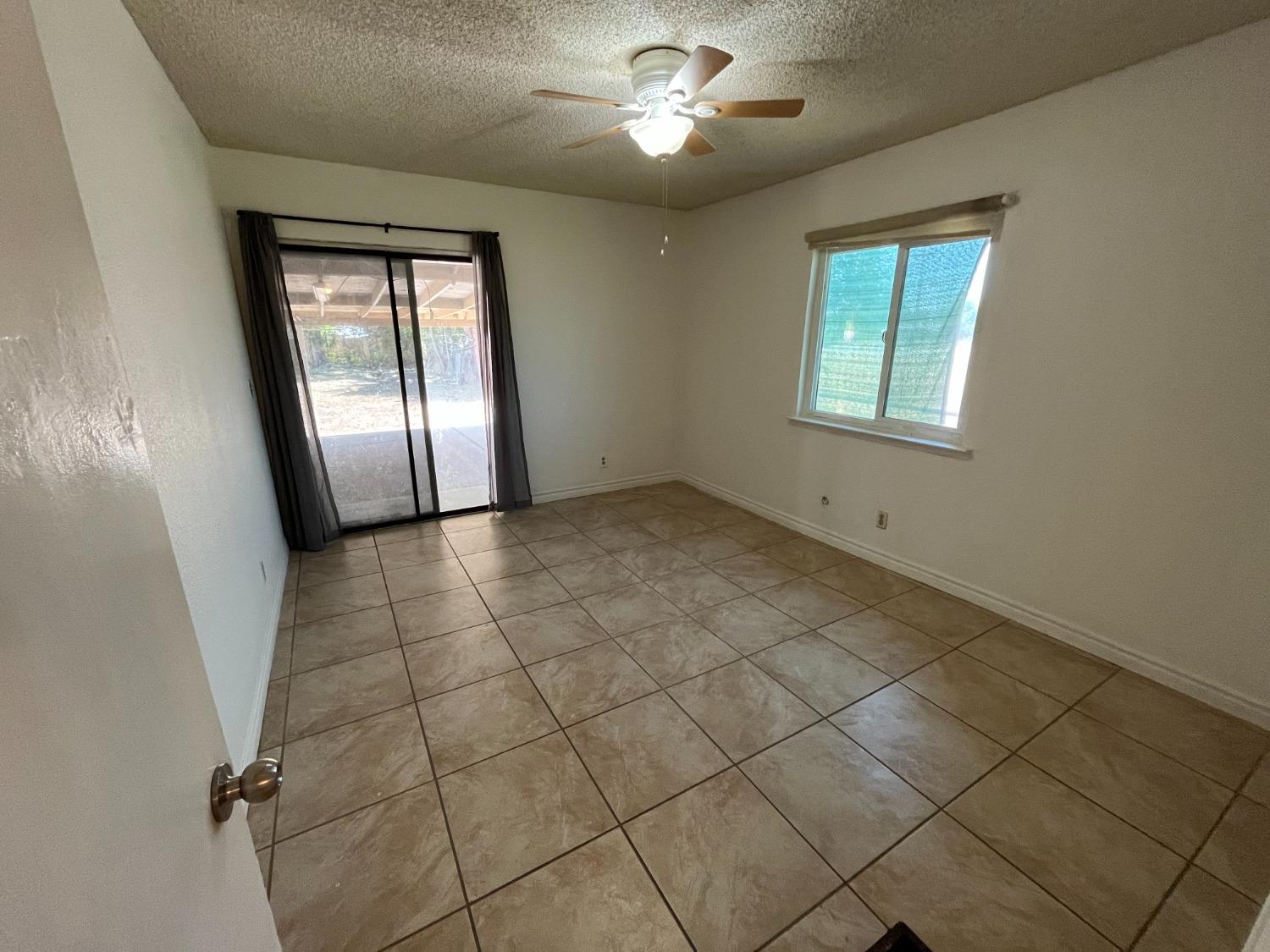 5433 Wildwood Del Rey, CA 93616 - Photo 15 of 17 a view of empty room with windows