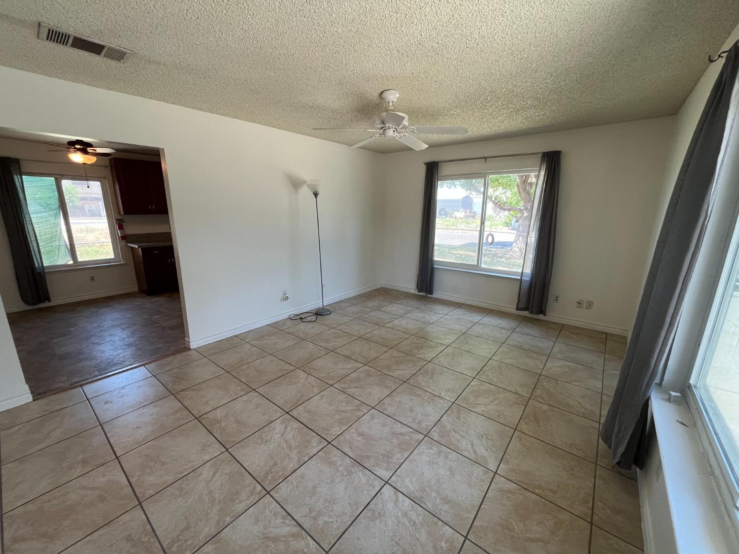 5433 Wildwood Del Rey, CA 93616 - Photo 6 of 17 wooden floor in an empty room with a window