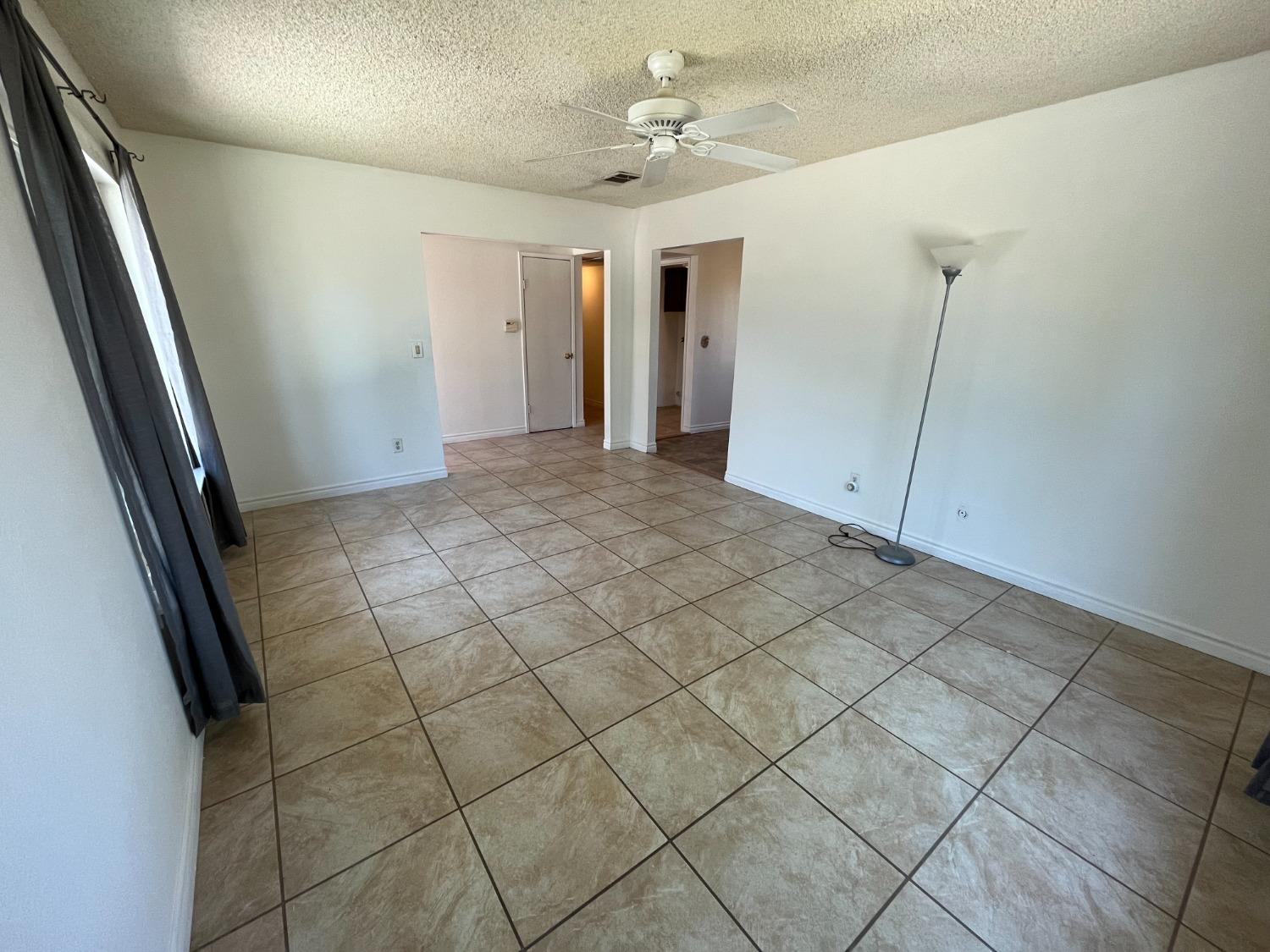 5433 Wildwood Del Rey, CA 93616 - Photo 7 of 17 a view of an empty room and a window