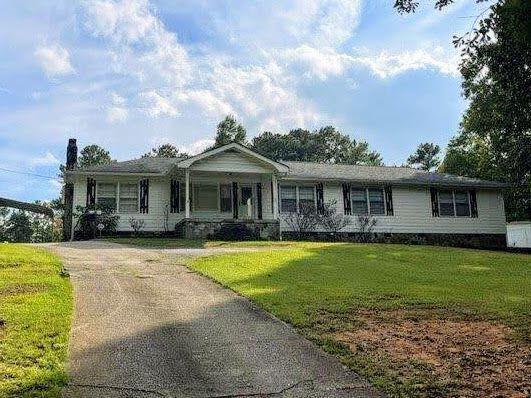 5451 Liberty Road Winston, GA 30187 - Photo 1 of 1 a front view of a house with a garden