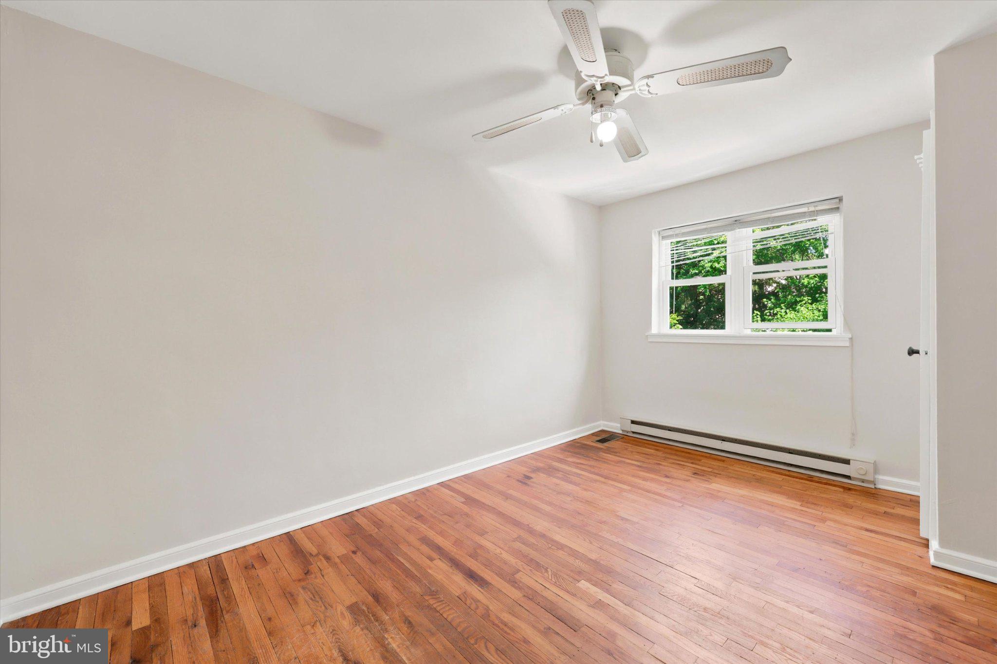 107 Plant Avenue Wayne, PA 19087 - Photo 6 of 15 Bright and airy room with hardwood floors.