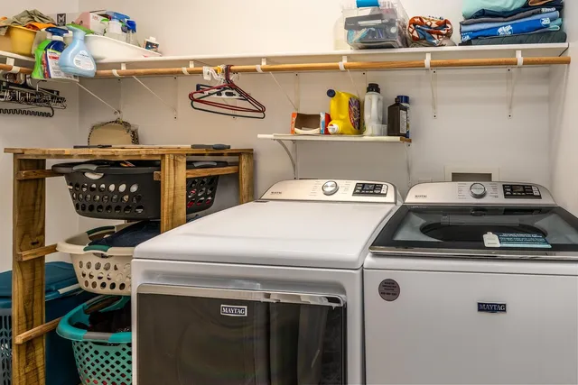 a utility room with dryer and washer