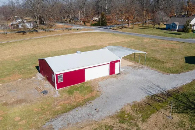 a view of swimming pool with red house