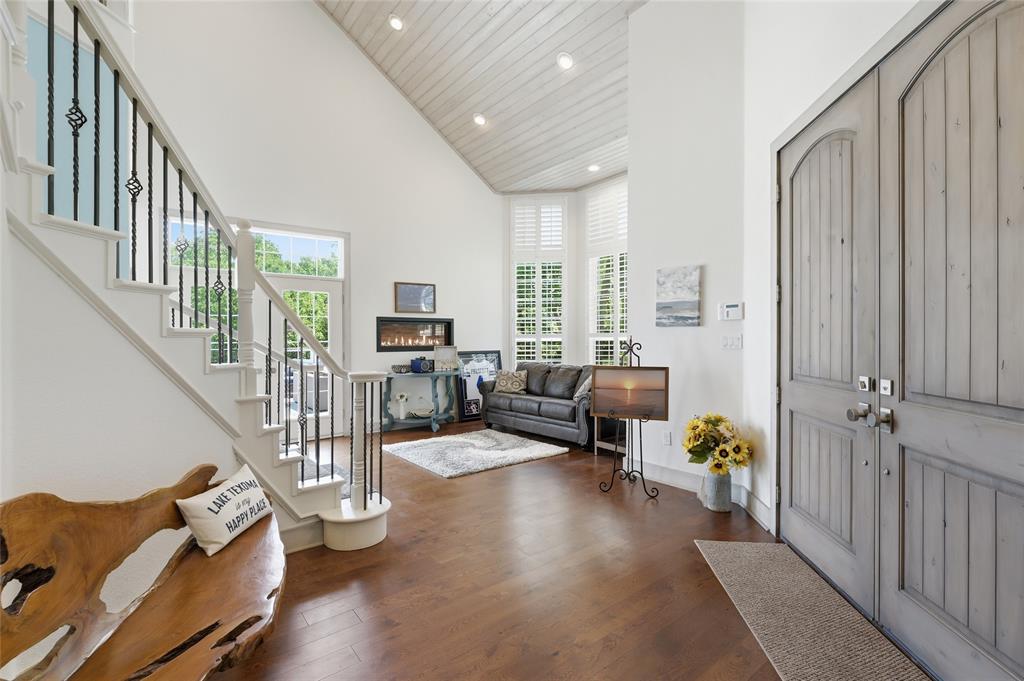 606 Lake Point Loop Pottsboro, TX 75076 - Photo 12 of 40 a living room with furniture stairs and a wooden floor