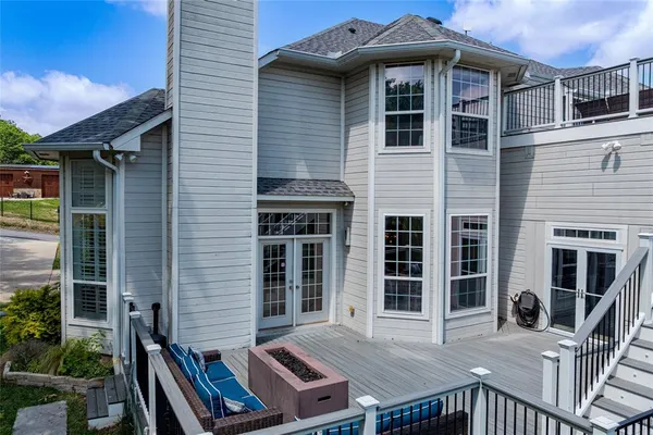 a view of a house with sitting area and balcony