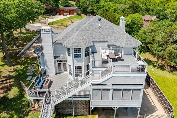 a aerial view of a house with a yard
