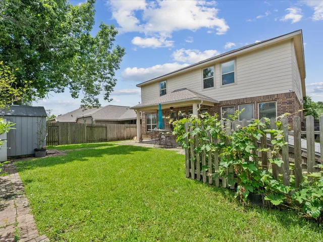 a view of a front of a house with a yard