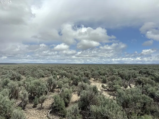 an aerial view of a city and mountain