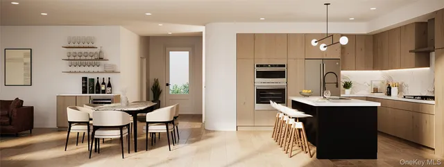 a kitchen with kitchen island a dining table chairs sink and microwave