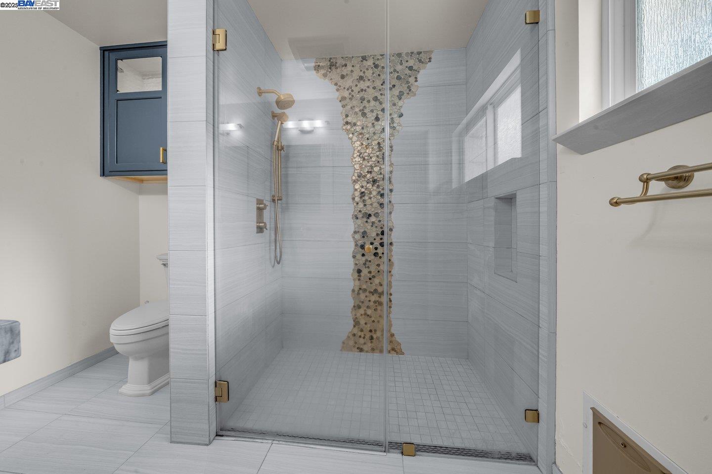 1876 Lynwood Drive Concord, CA 94519 - Photo 19 of 39 a bathroom with a shower a toilet and a window