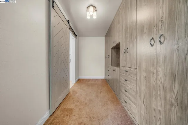 a bedroom with a bed and a potted plant