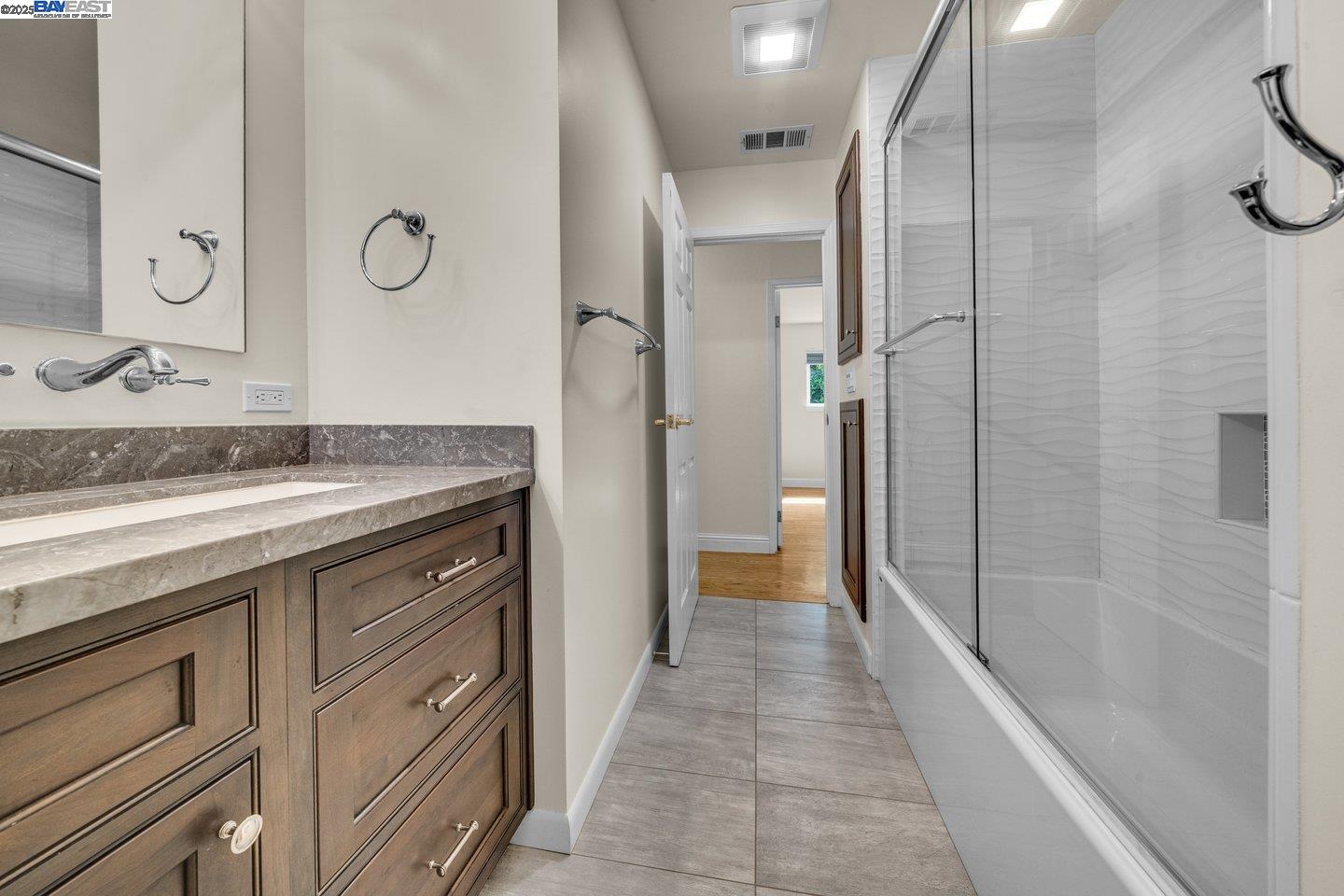 1876 Lynwood Drive Concord, CA 94519 - Photo 29 of 39 a spacious bathroom with a granite countertop sink mirror and shower