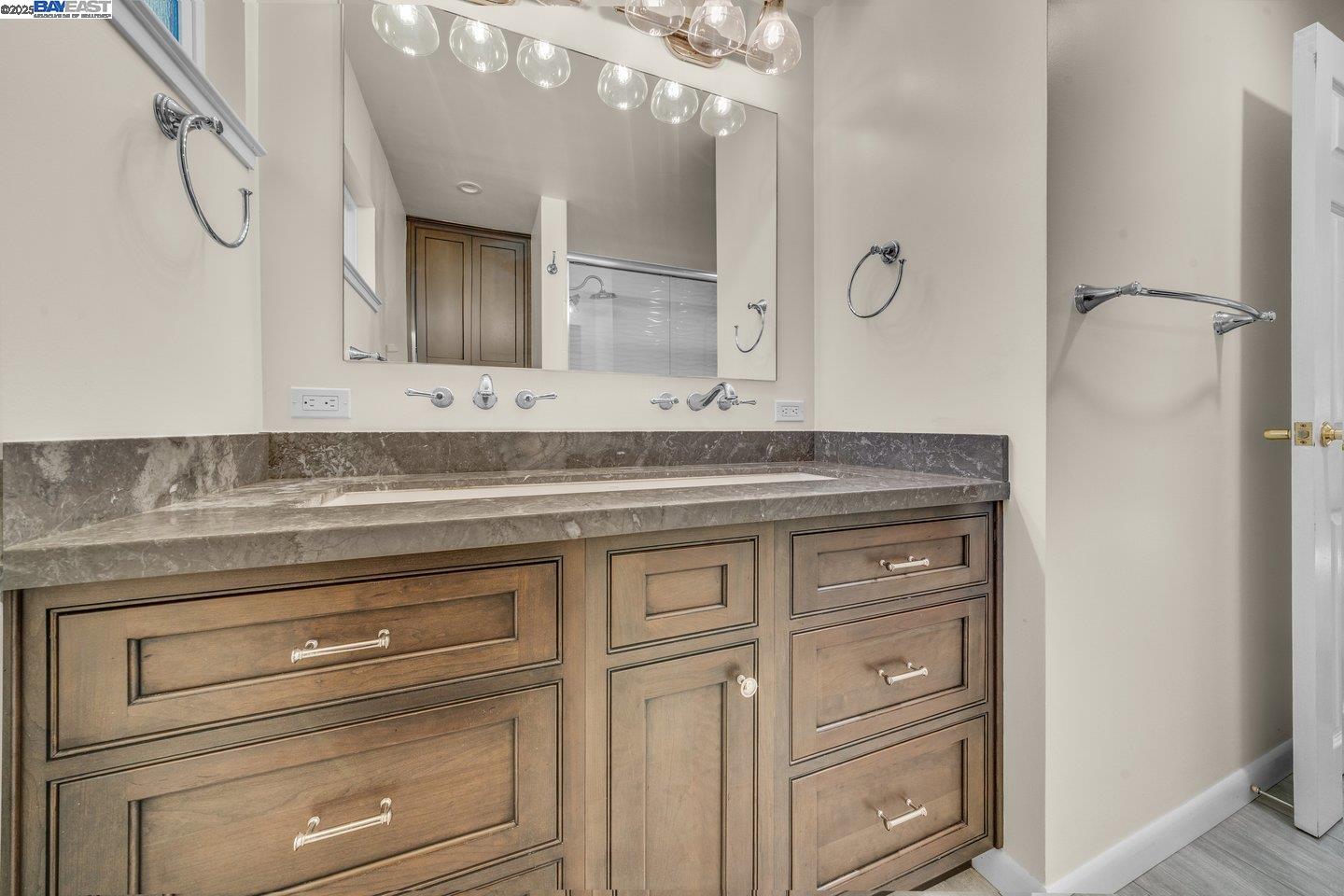 1876 Lynwood Drive Concord, CA 94519 - Photo 31 of 39 a bathroom with a granite countertop sink vanity mirror and