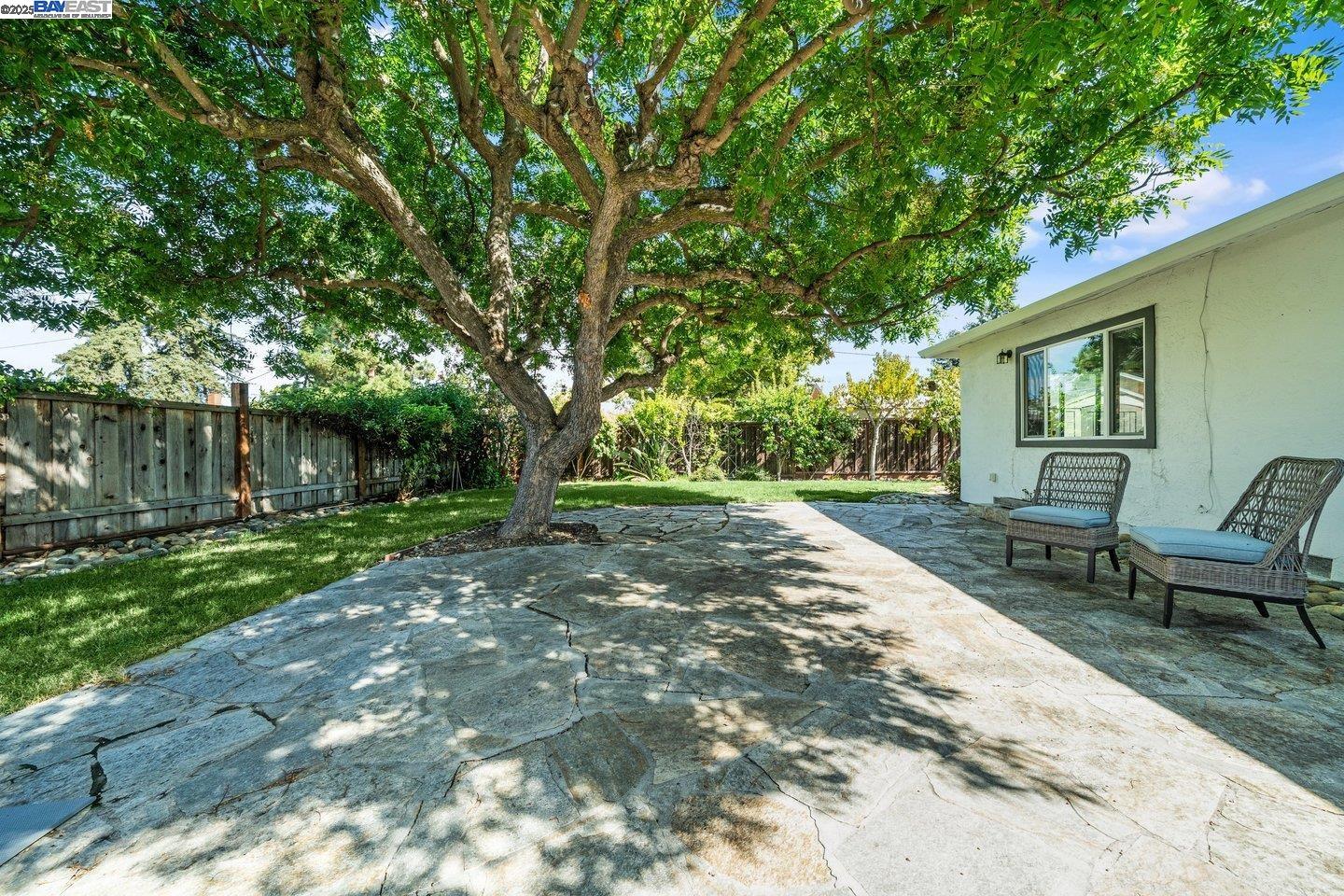 1876 Lynwood Drive Concord, CA 94519 - Photo 34 of 39 a view of a backyard with table and chairs and a barbeque