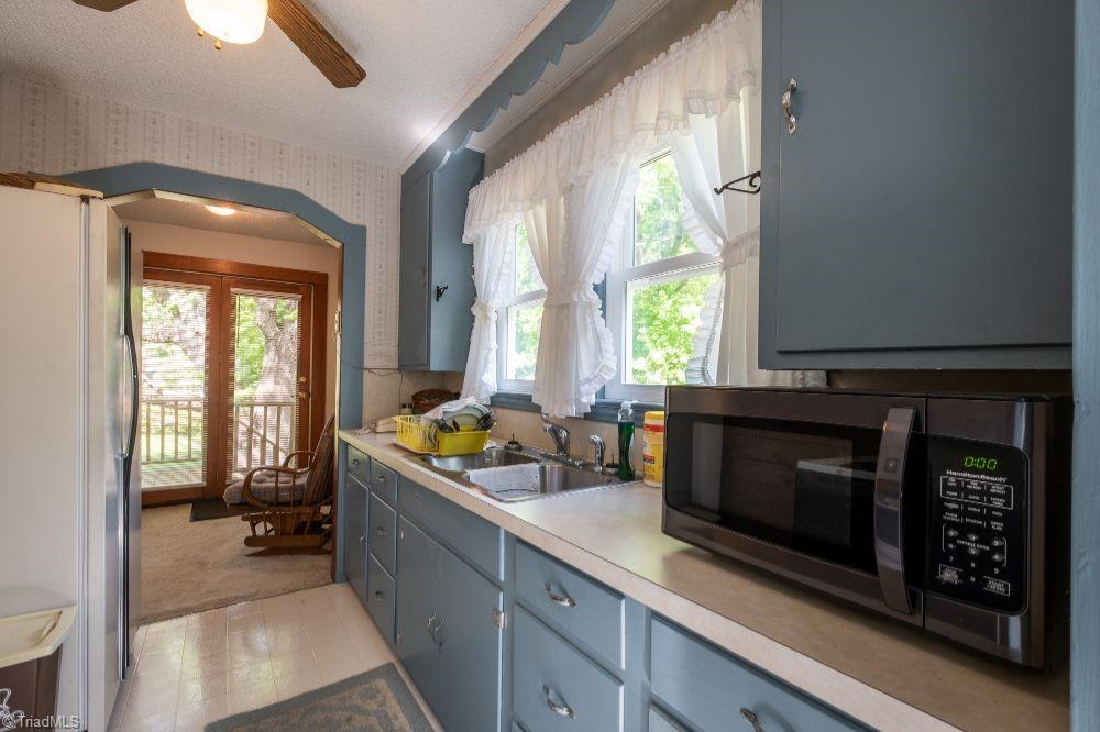 136 Mill Road State Road, NC 28676 - Photo 13 of 25 Kitchen looking toward breakfast room and French doors leading to back deck.