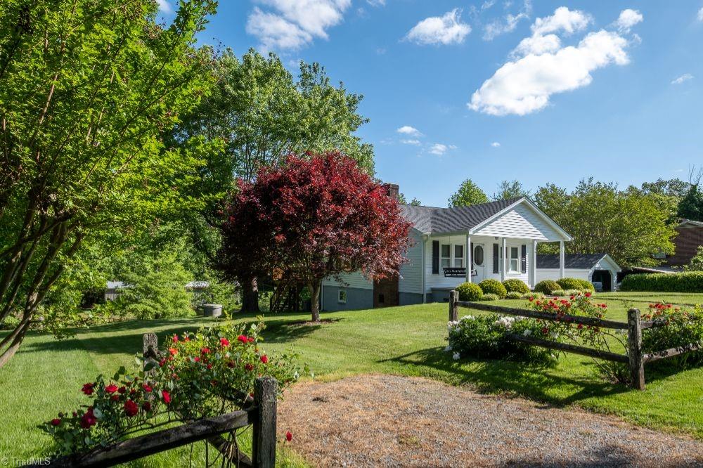 136 Mill Road State Road, NC 28676 - Photo 24 of 25 136 Mill Road, State Road features mature landscaping.