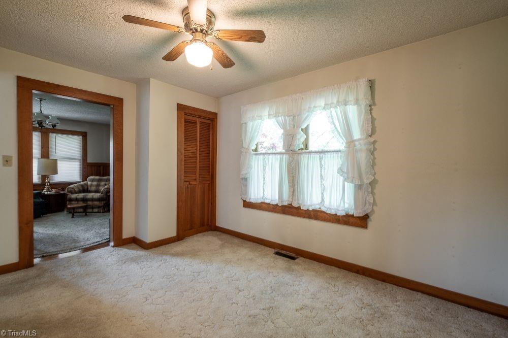 136 Mill Road State Road, NC 28676 - Photo 8 of 25 Dining room with ceiling fan looking into family room.