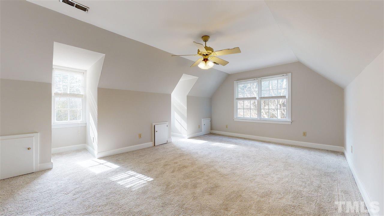 1301 October Road Raleigh, NC 27614 - Photo 22 of 30 an empty room with windows and ceiling fan